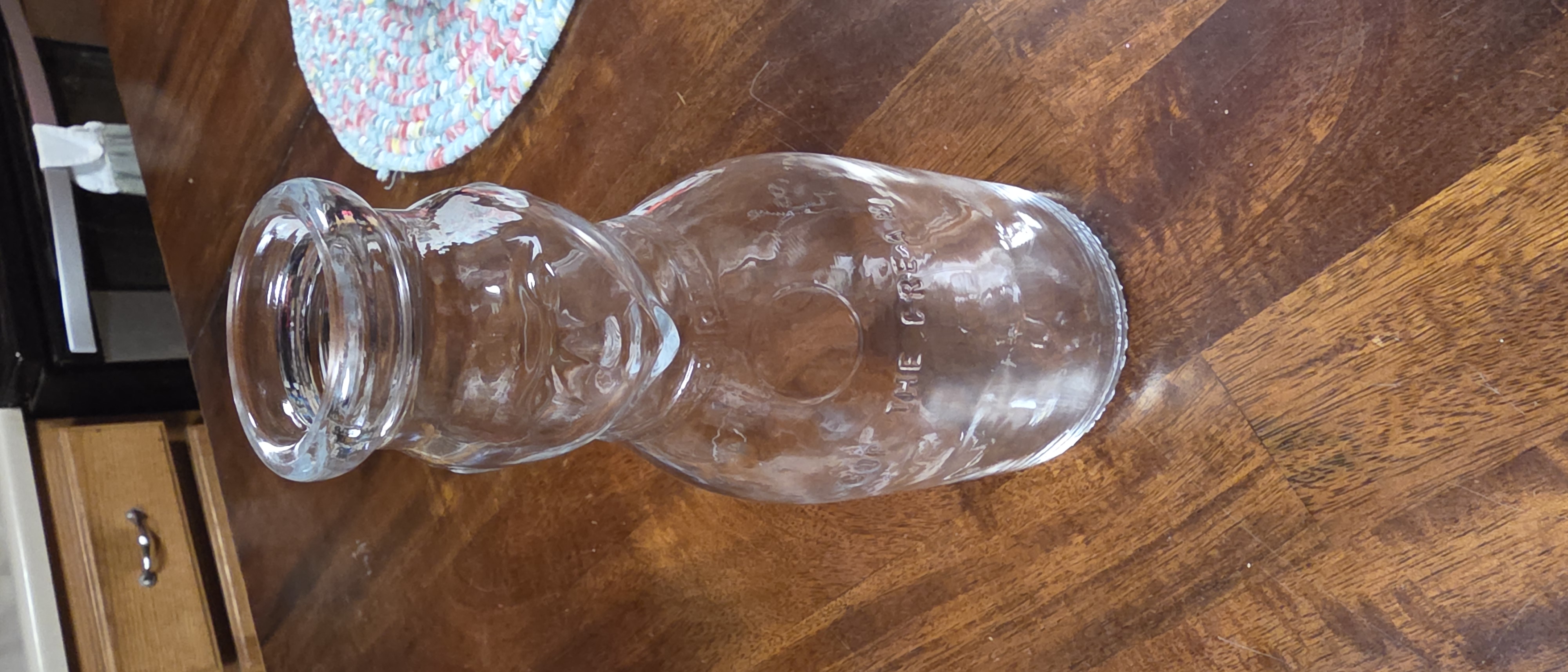 Vintage Glass Bottle with Face Design